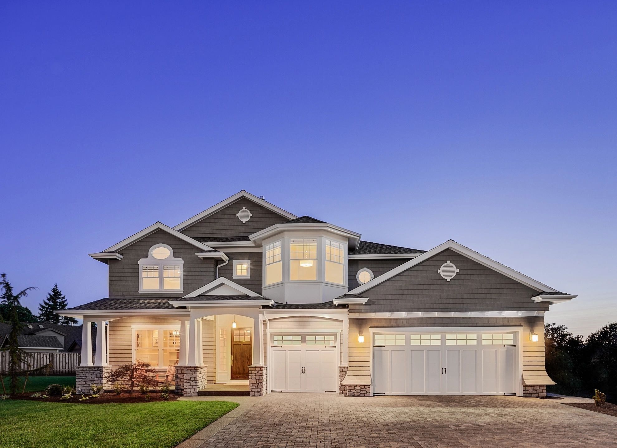 Custom craftsman home at twilight — Mavericks BC building design and structural engineering, Victoria, BC